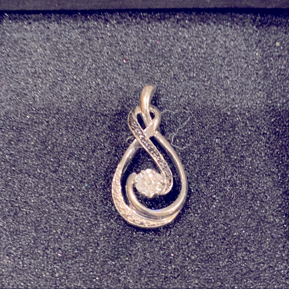 Sterling silver. Infinity-style diamond pendant.